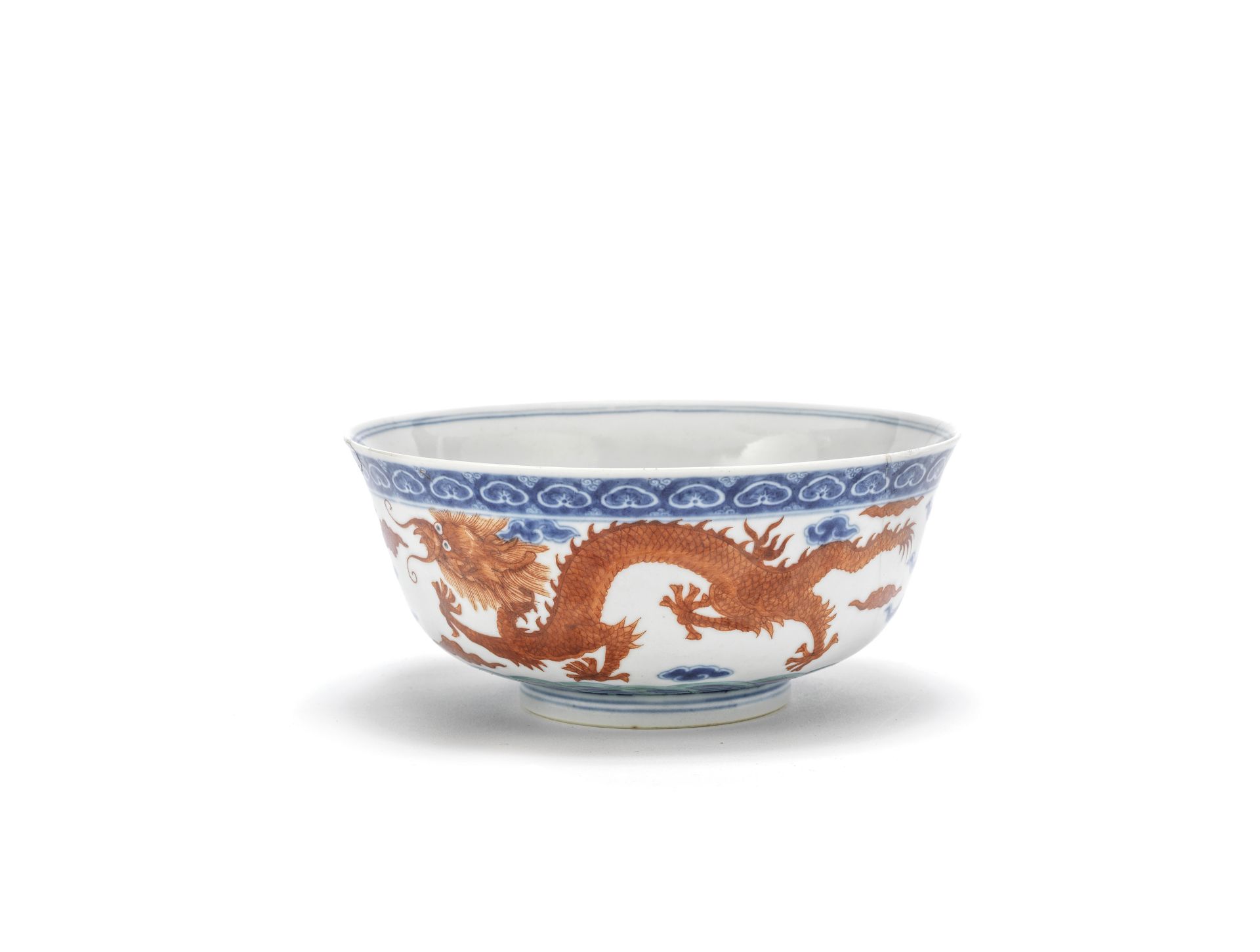 A blue and white, iron red and green enamelled 'dragon' bowl, Cai hua tang zhi iron red mark, 19t...