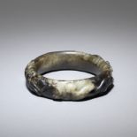 A black and white jade 'chilong' bangle Ming Dynasty