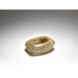 A pale green and russet jade washer Qing Dynasty or later