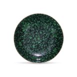 A green and black enamelled 'lotus' saucer Qianlong minyao seal mark and of the period