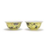 An unusual pair of 'Dayazhai' grisaille-enamelled yellow-ground octagonal bowls Yong qing chang c...