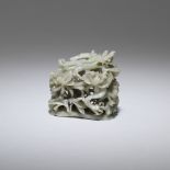 A green jade 'dragon and lotus' hat finial Ming Dynasty