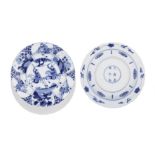 A pair of blue and white 'hunting' foliate-rimmed dishes Kangxi six-character marks and of the pe...