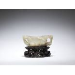 A white and mushroom jade 'lingzhi, lotus and prunus' reticulated cup Ming Dynasty (2)