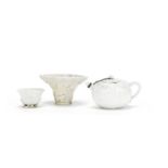 A blanc-de-chine teapot and cover, a blanc-de-chine cup, and a libation cup 17th-18th century (7)
