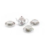 A group of three famille rose tea cups and saucers and a teapot and cover 18th century (8)