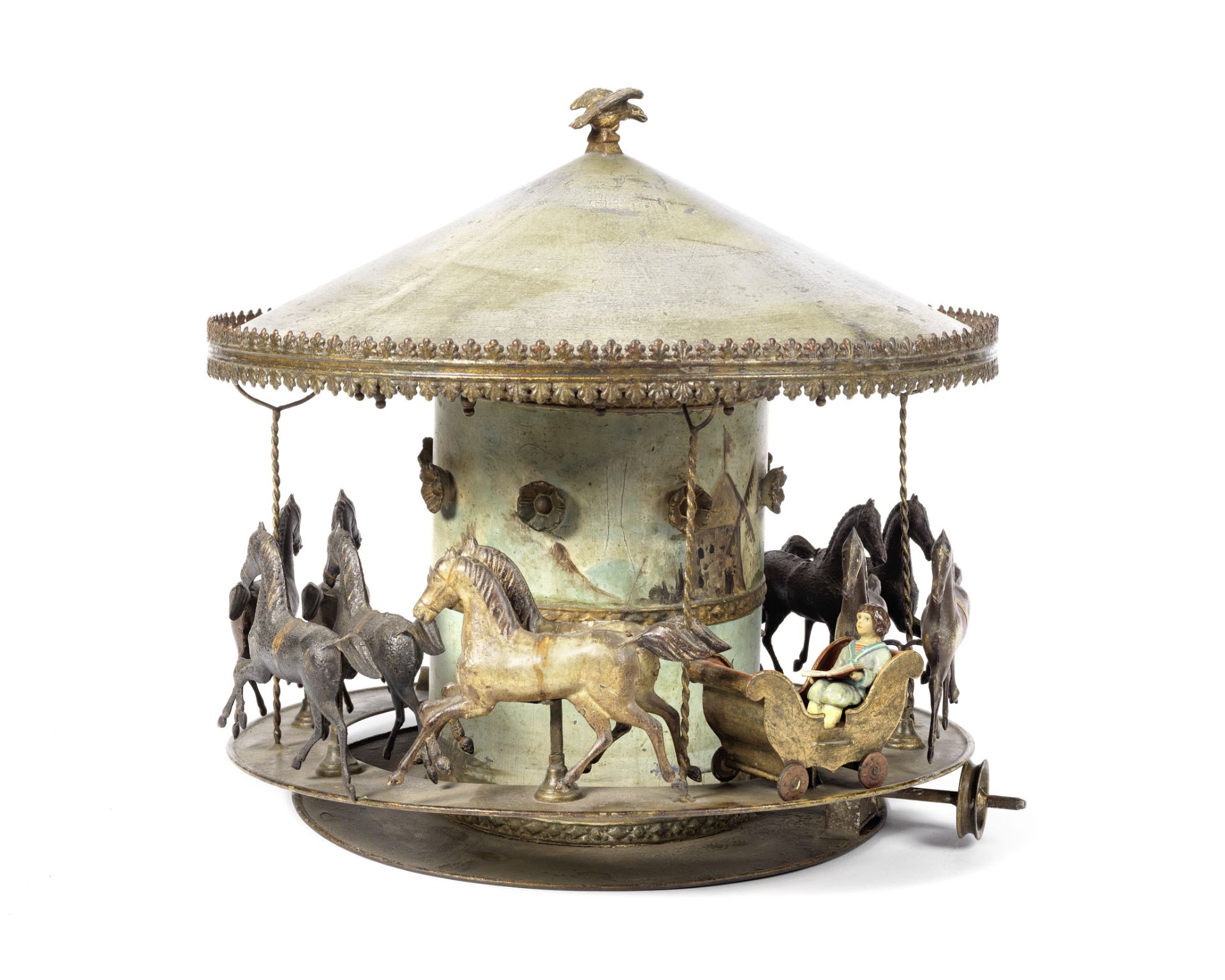 A decorative tinplate Carousel toy, probably German 1890s 36cm (14in) high x 38cm (15in) wide.