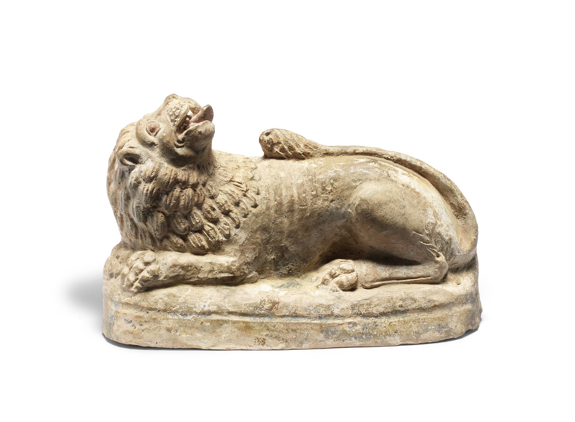 A Greek terracotta recumbent lion