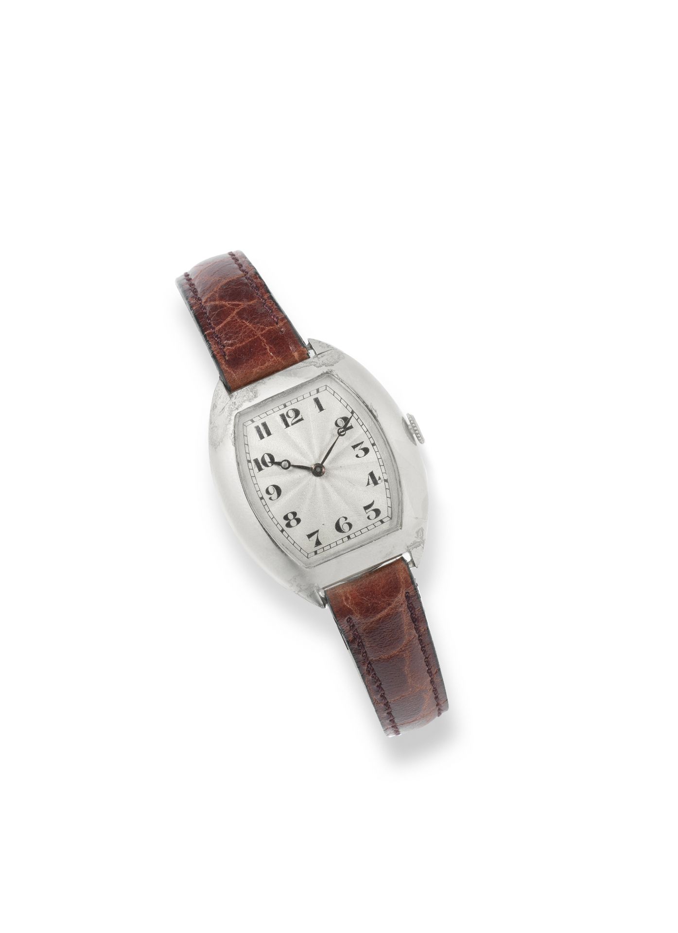 Attributed to Cartier. An early 18K white gold manual wind tonneau form wristwatch Circa 1926