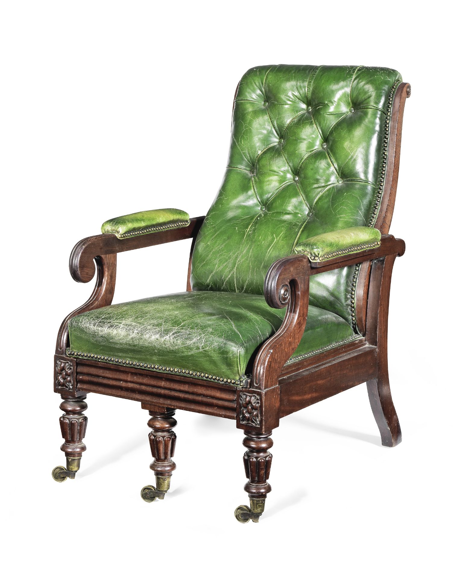 A George IV mahogany reclining armchair in the manner of Gillows