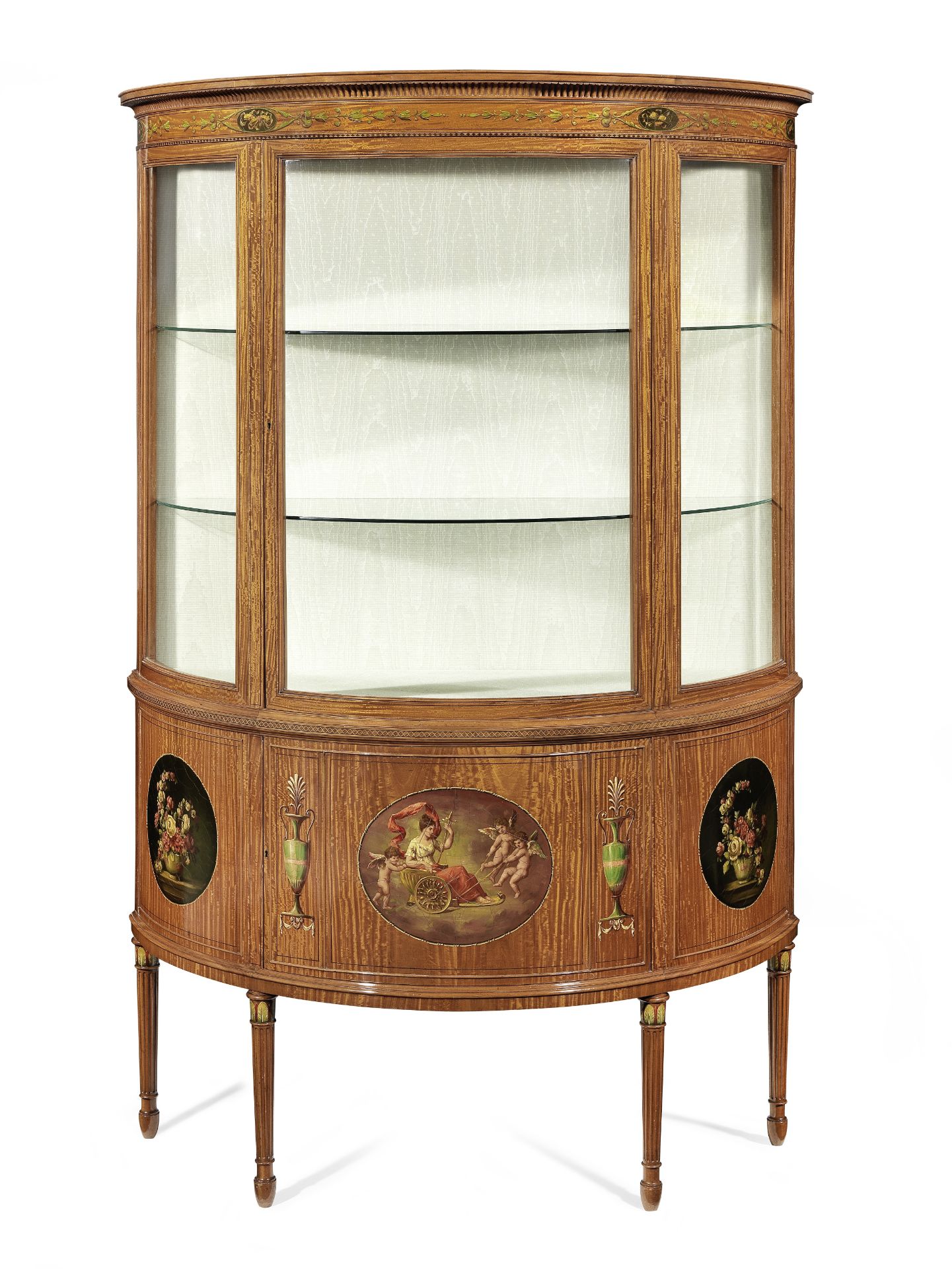 An Edwardian satinwood and polychrome decorated demi-lune display cabinet