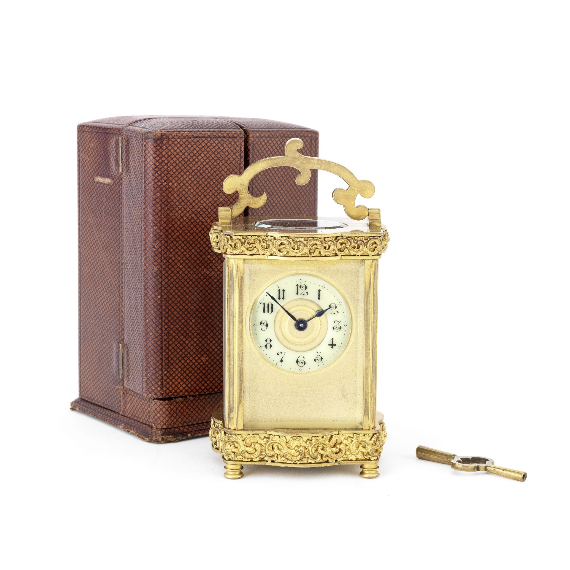 A late 19th century French lacquered brass carriage timepiece in original silk-and vevet-lined tr...