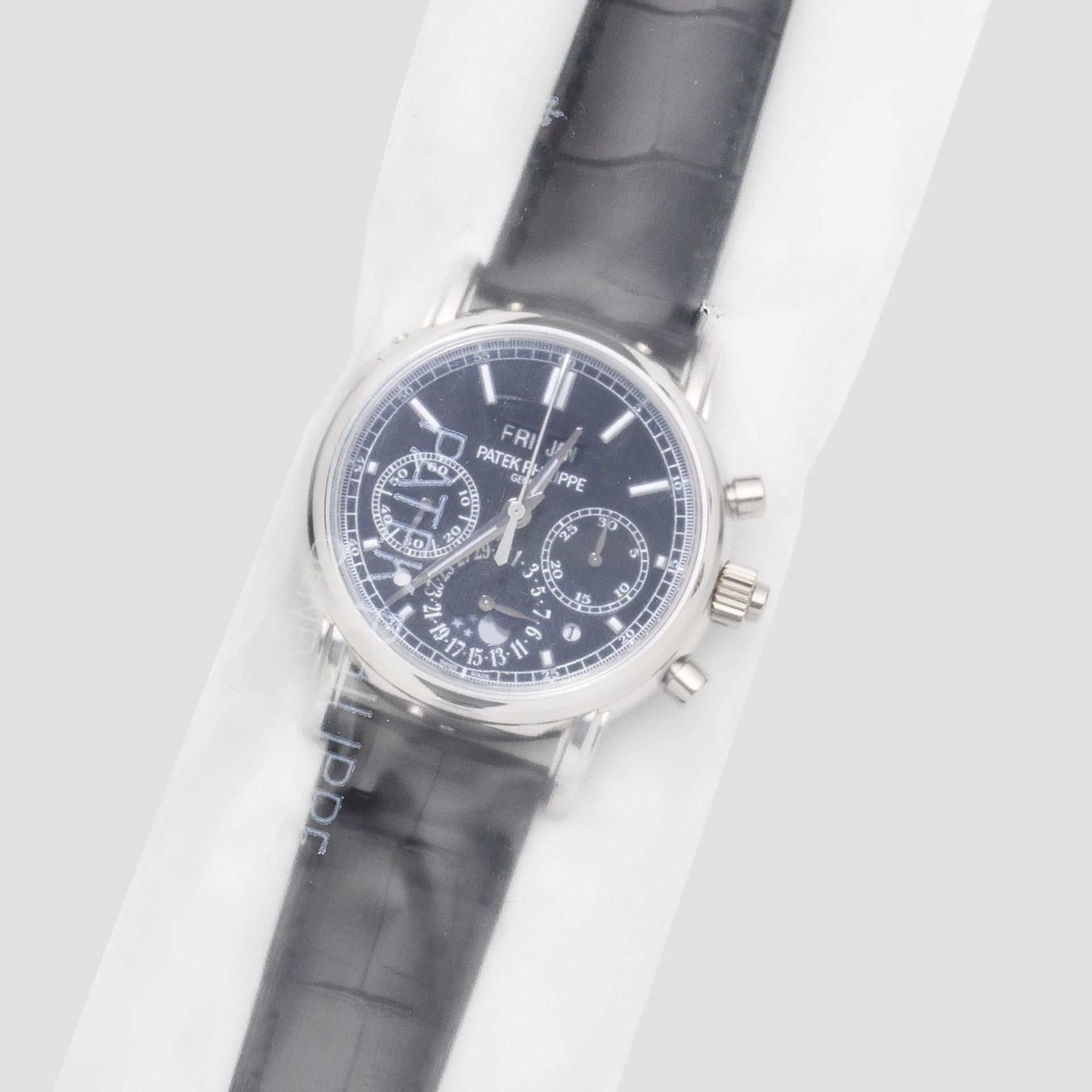 Patek Philippe. A very fine and rare factory sealed platinum manual wind split second chronograph...