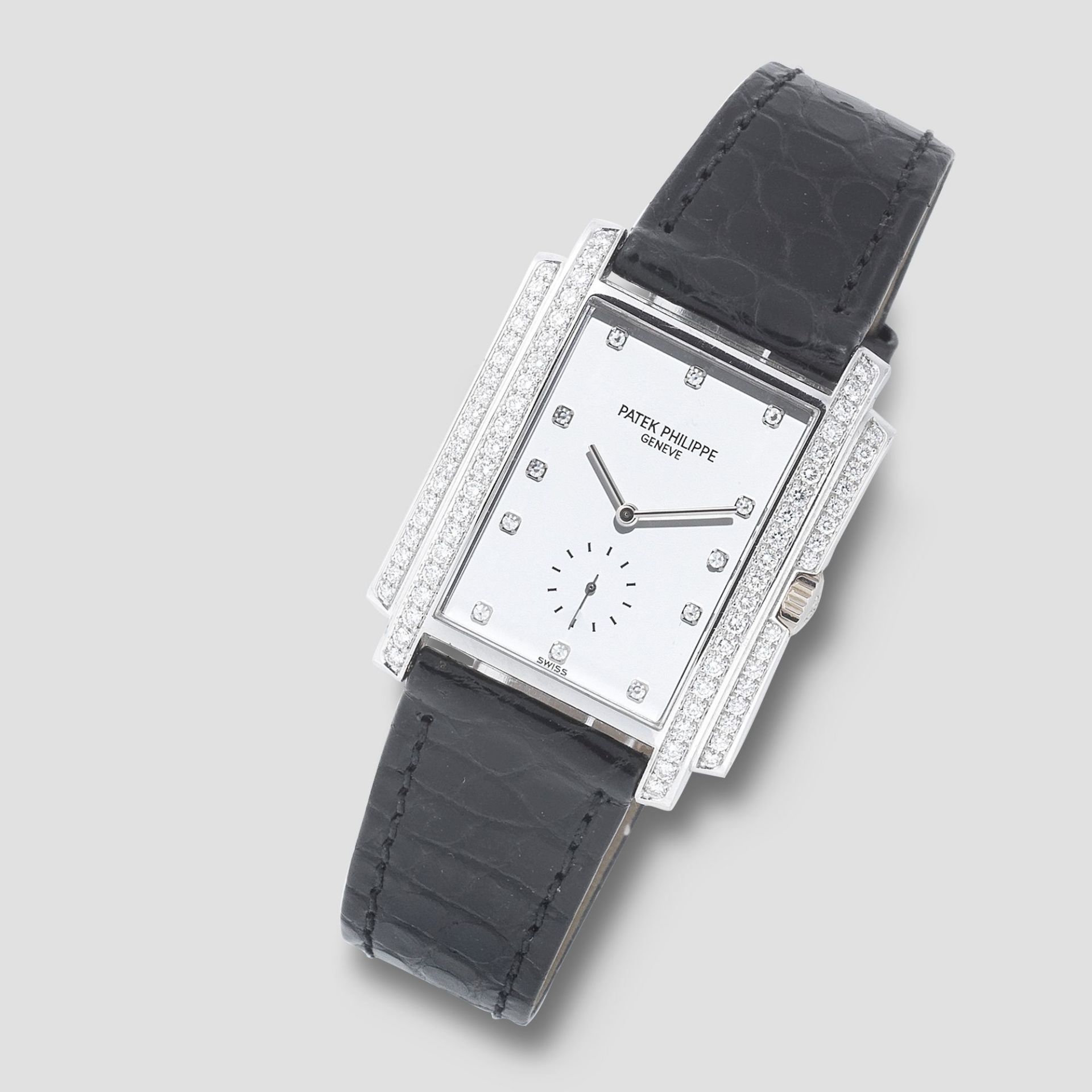 Patek Philippe. An 18K white gold and diamond set manual wind rectangular wristwatch Gondolo, Re...