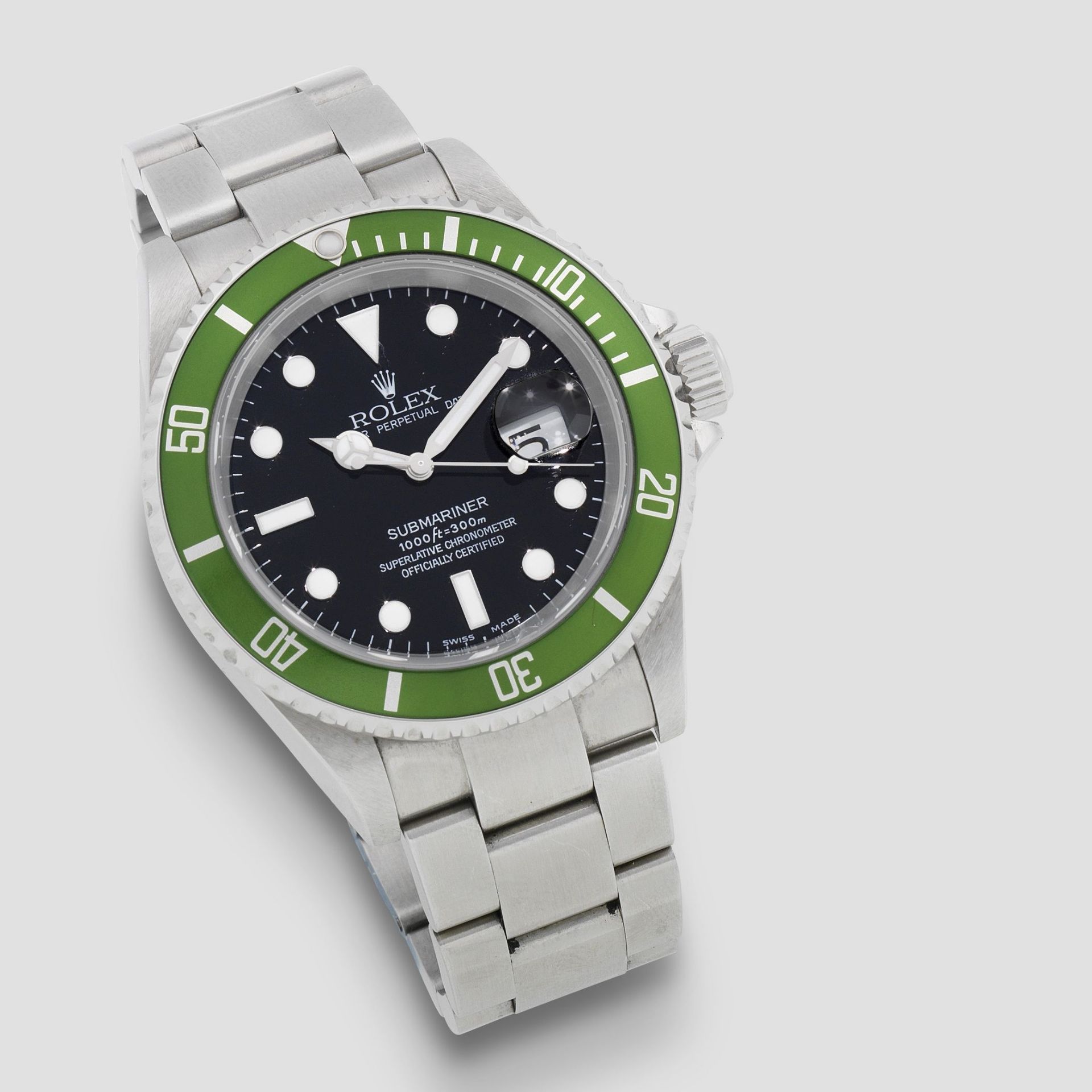 Rolex. A stainless steel automatic calendar bracelet watch with 'flat 4' bezel insert Submariner...