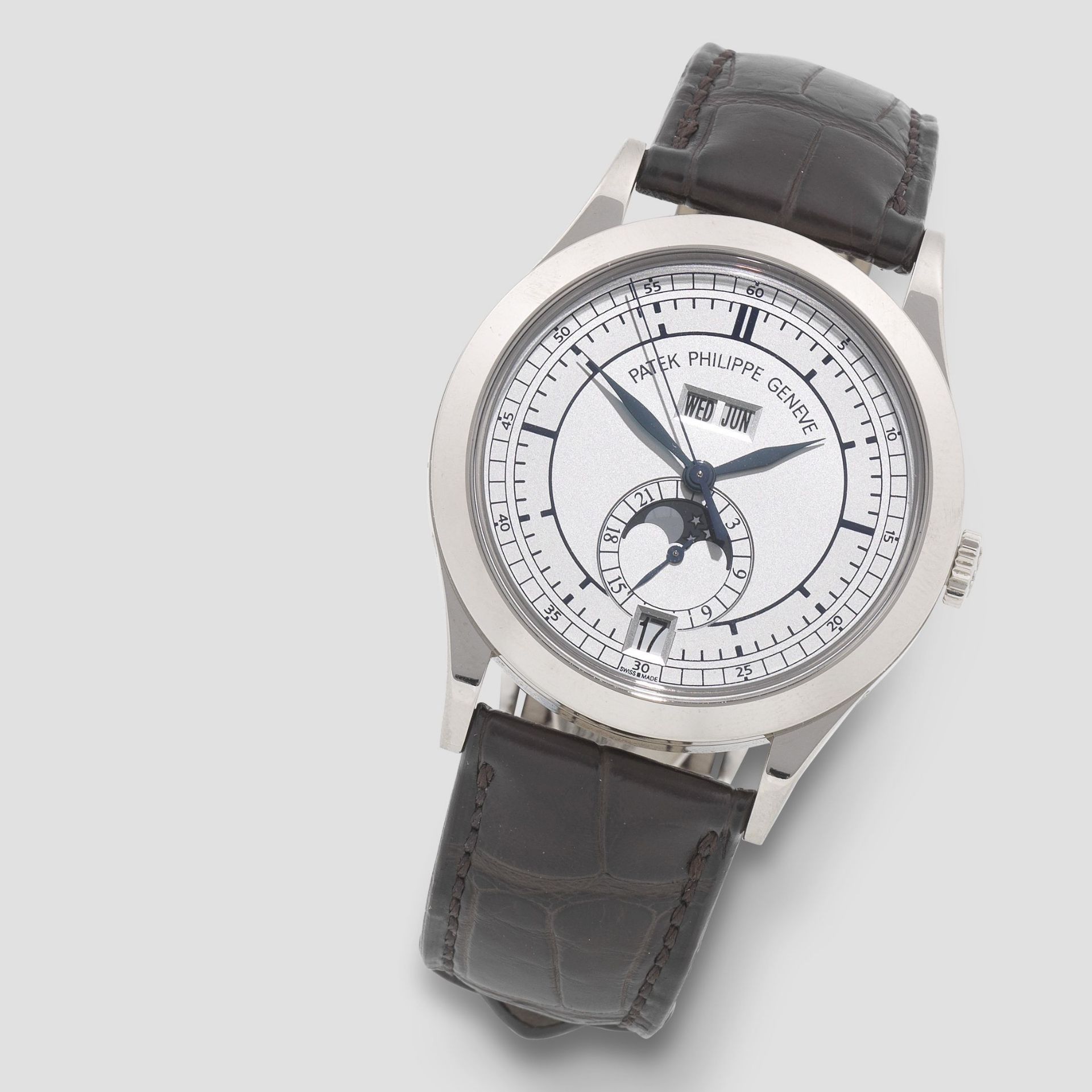 Patek Philippe. A fine 18K white gold automatic annual calendar wristwatch with moon phase Ref: 5...