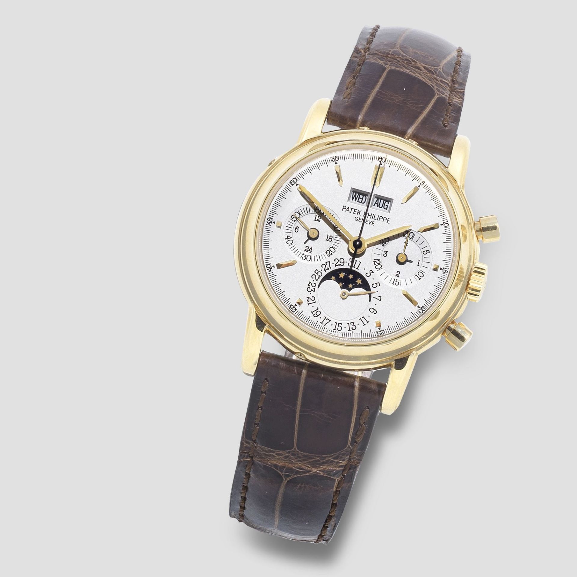 Patek Philippe. A fine 18K gold manual wind perpetual calendar chronograph wristwatch with moon p...