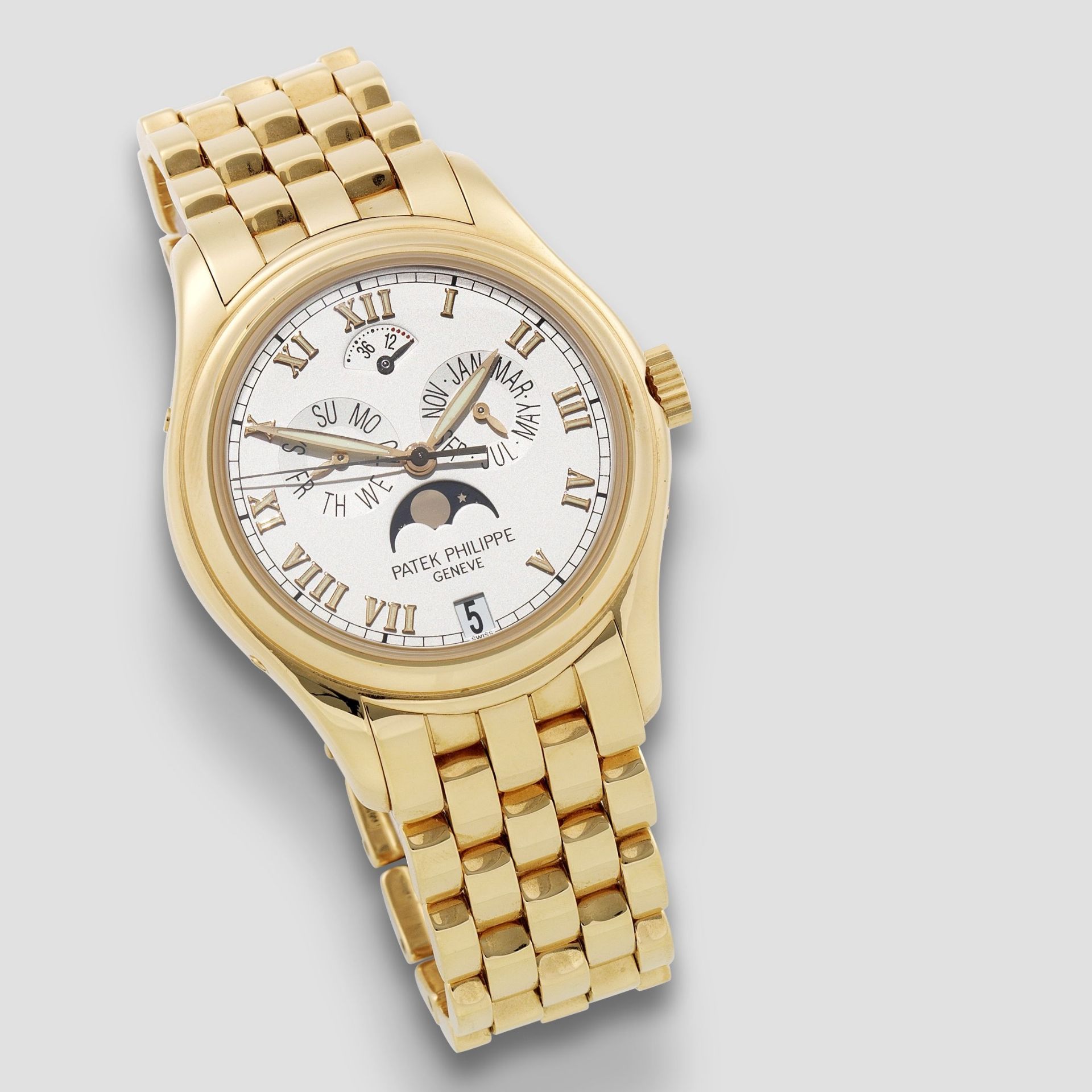 Patek Philippe. A fine 18K gold automatic annual calendar bracelet watch with moon phase Ref: 503...