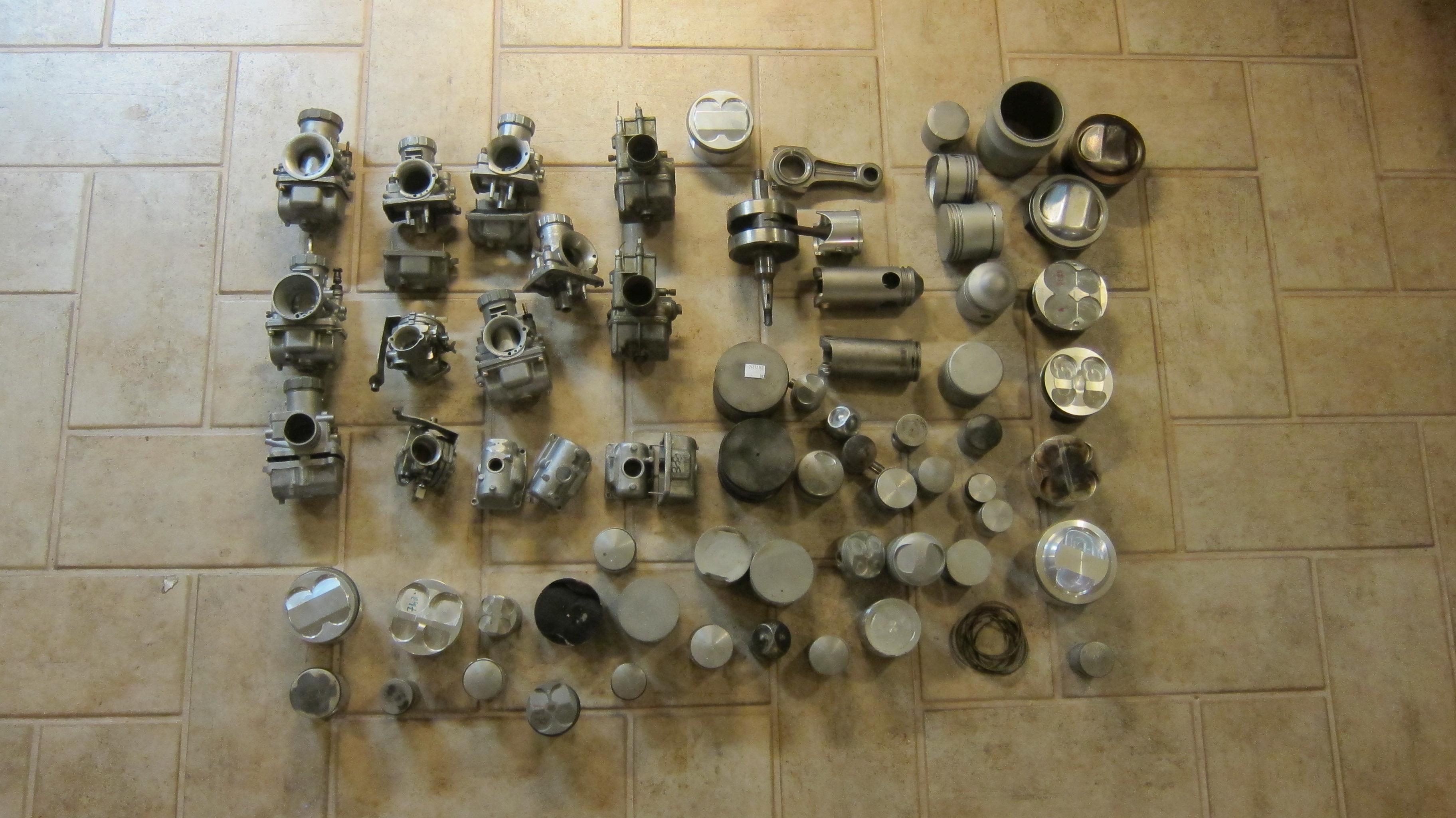 A quantity of carburettors, pistons and related parts ((Qty))