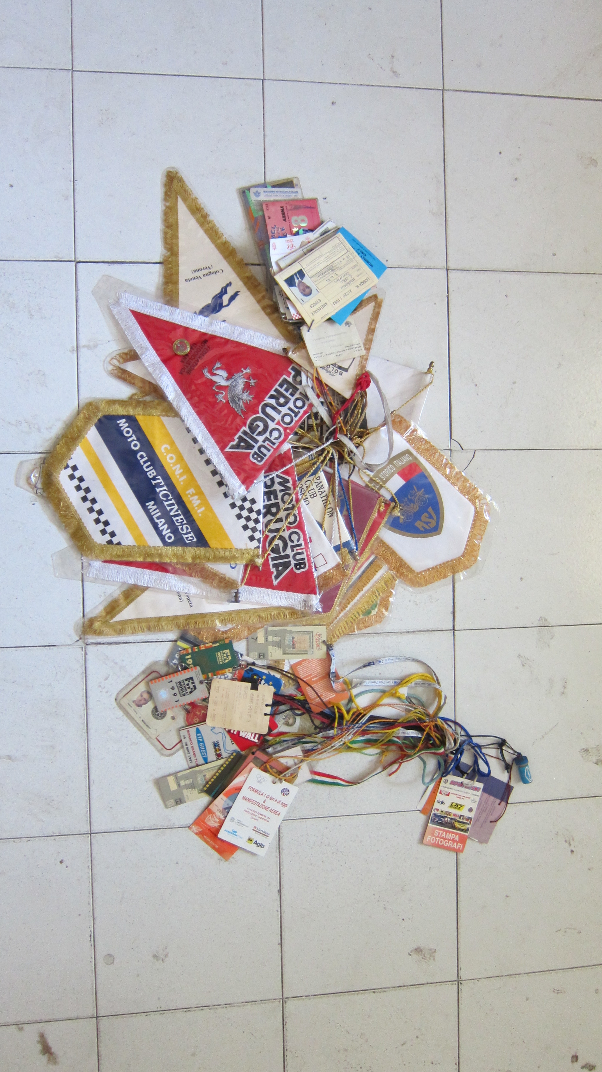 A large quantity of paddock passes and pennants ((Qty))