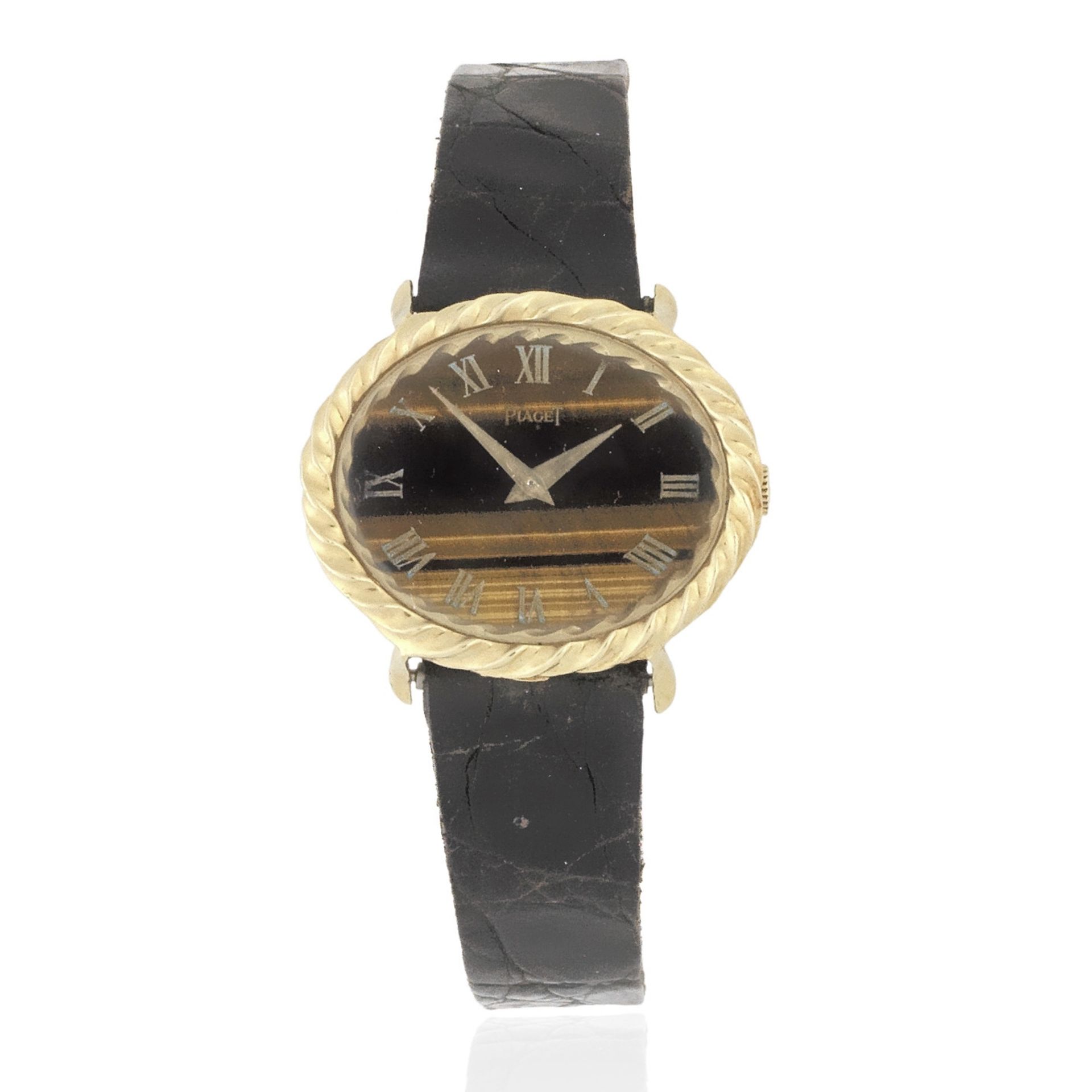 Piaget. A lady's 18K gold manual wind oval wristwatch with tiger's eye dial Ref: 9803, Circa 1980