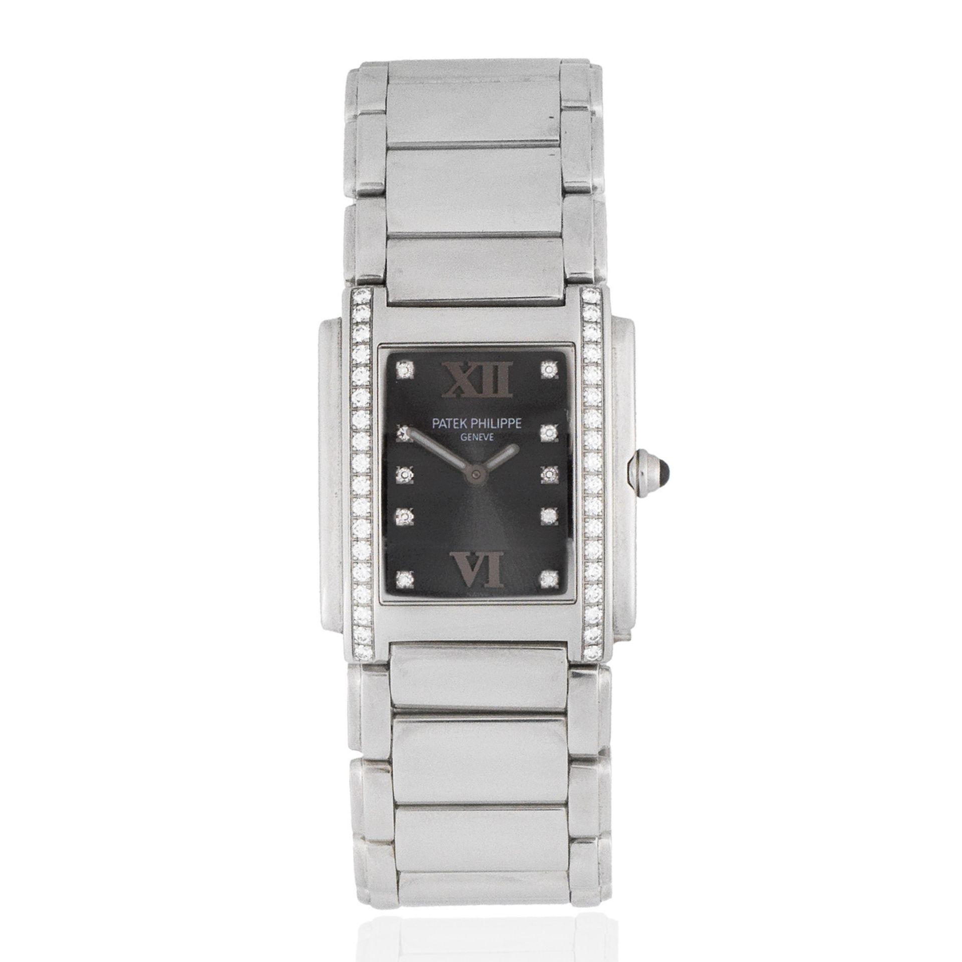 Patek Philippe. A lady's stainless steel and diamond set quartz rectangular bracelet watch Twent...