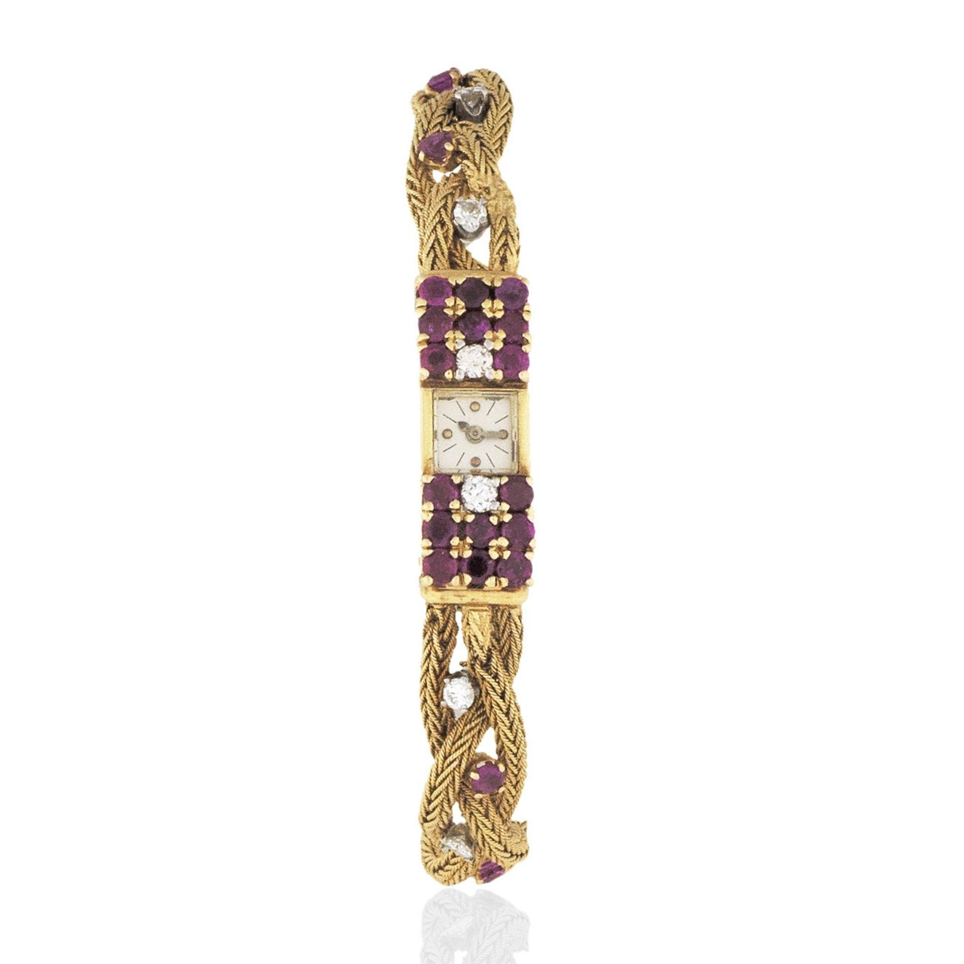 Vacheron & Constantin. A lady's diamond and ruby set 18K gold manual wind cocktail bracelet watch...