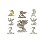 A Group Of Silvered, Ormolu And White-Metal Carriage Badges (8)