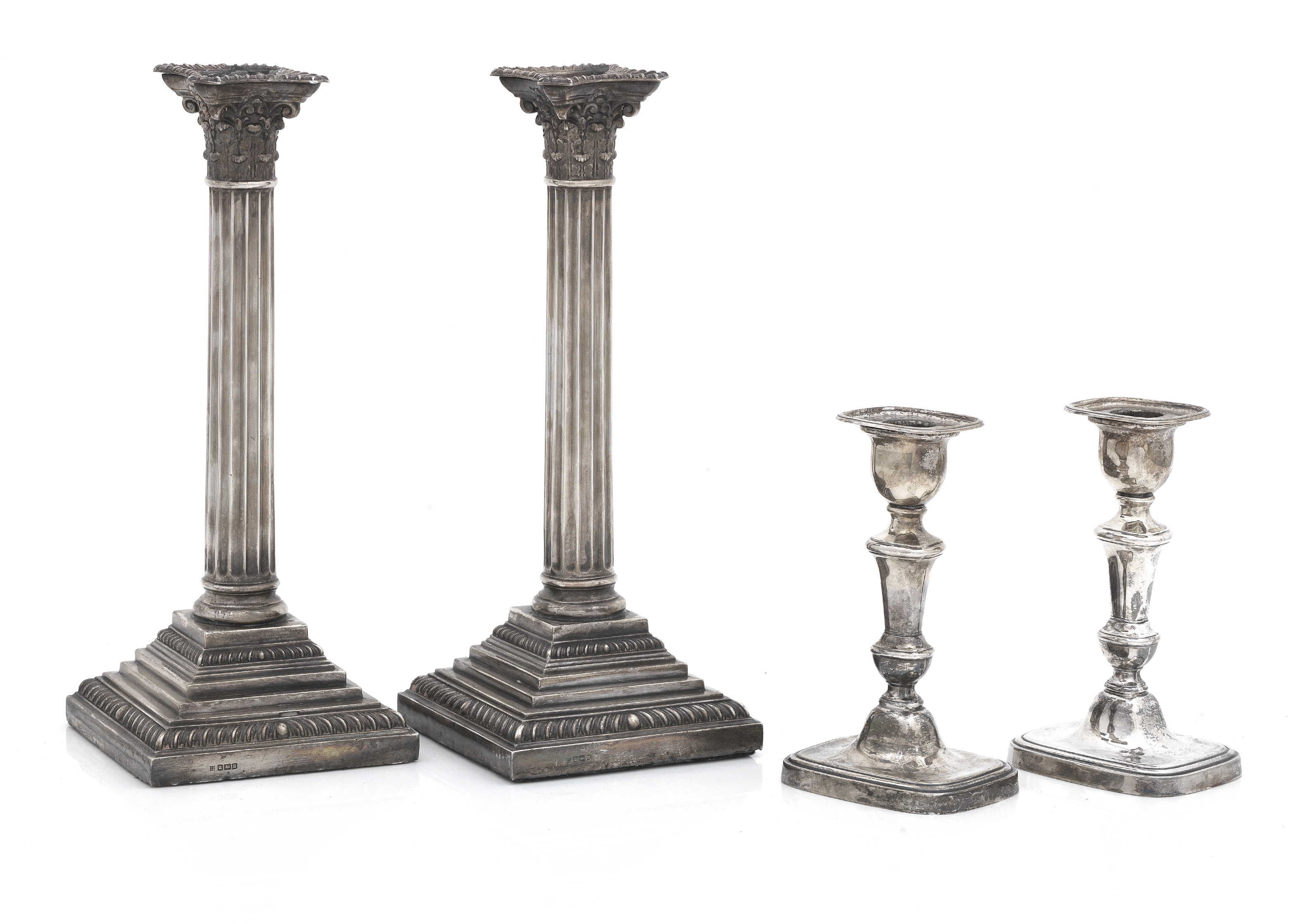 A pair of George V silver cornithian column candlesticks maker's mark WL&S, Sheffield, 1912 (4)