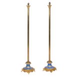 A pair of early 20th century gilt metal and porcelain standard lamps (2)