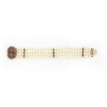 A cultured pearl bracelet with gem-set clasp