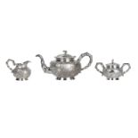 A three piece Chinese export silver tea service by Woshing of Shanghai (4)