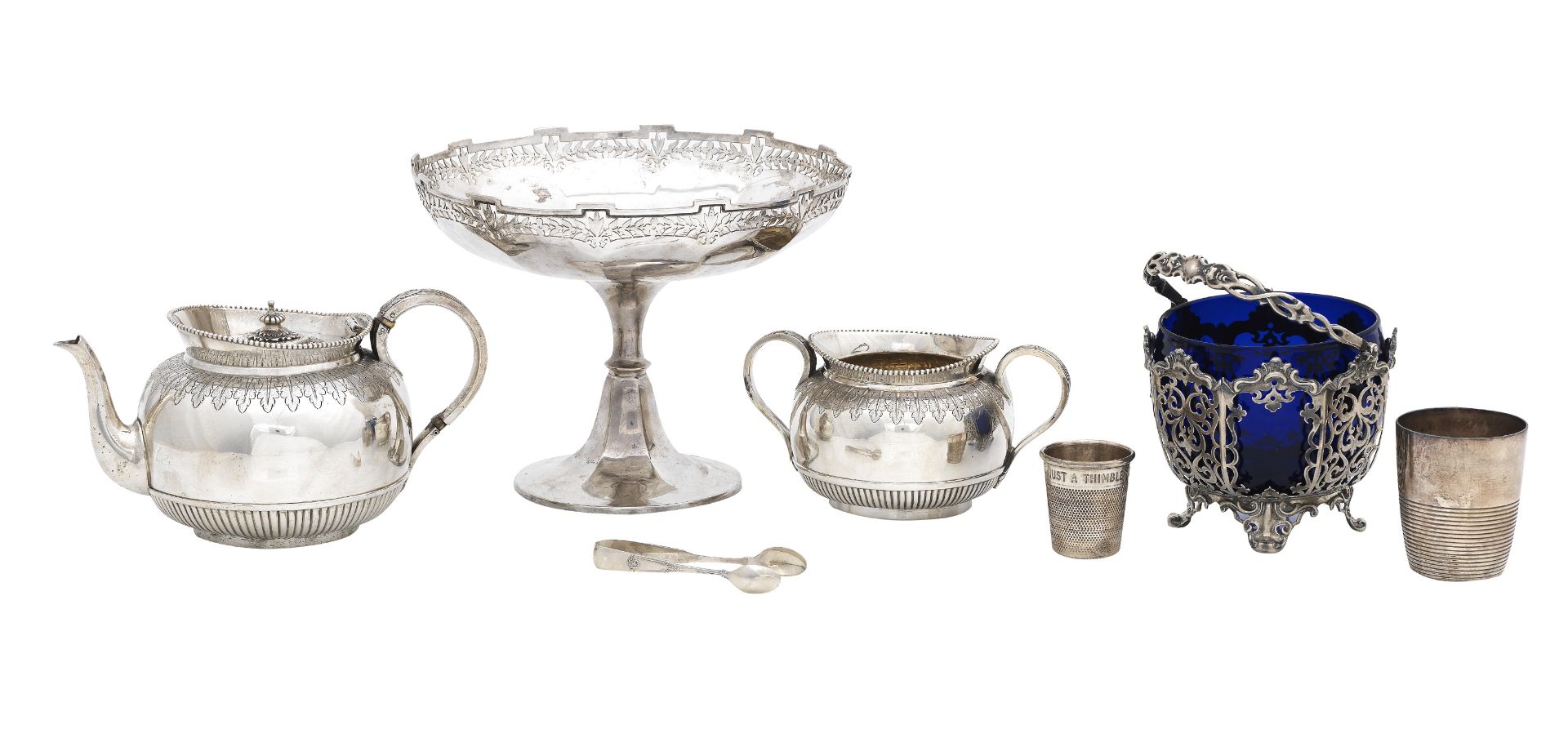 A collection of silver to include a teapot, a sugar bowl, a comport, a basket, an over-sized thim...