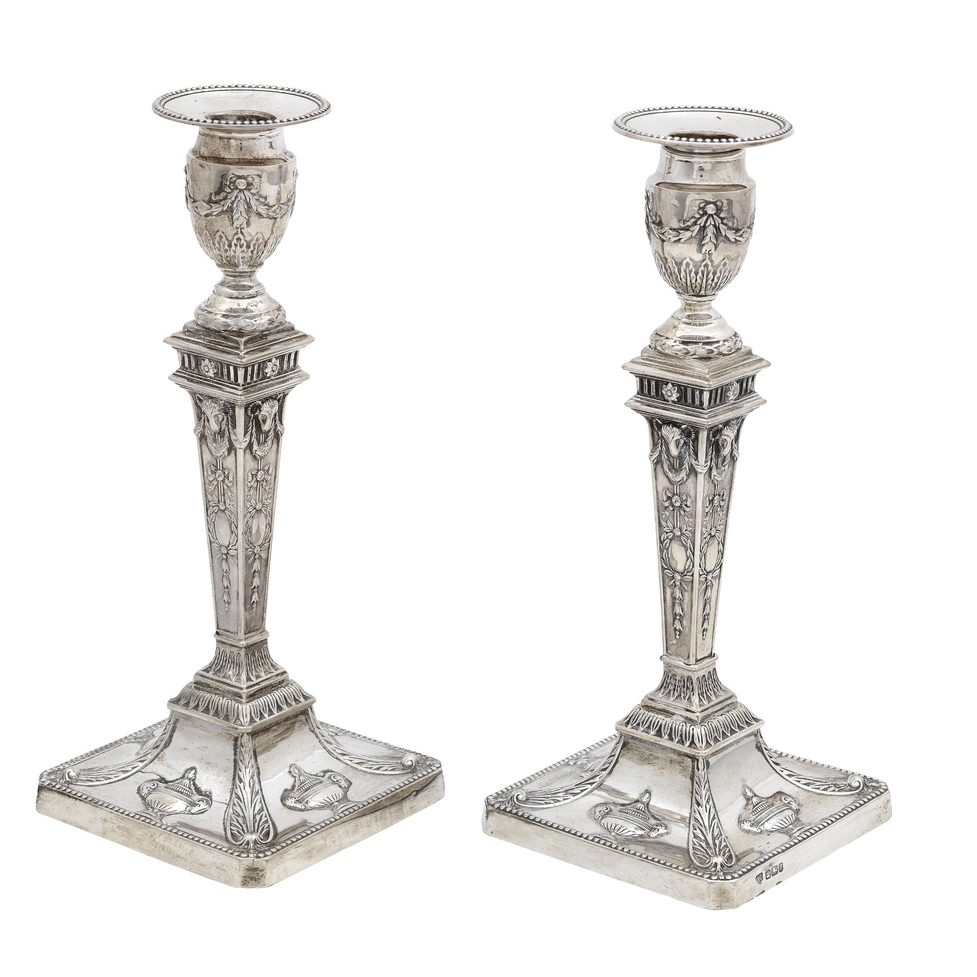 A pair of silver candlesticks maker's mark HE, Sheffield, 1899