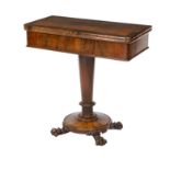 A 19th century crossbanded rosewood tea table