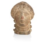 An Etruscan terracotta votive female head