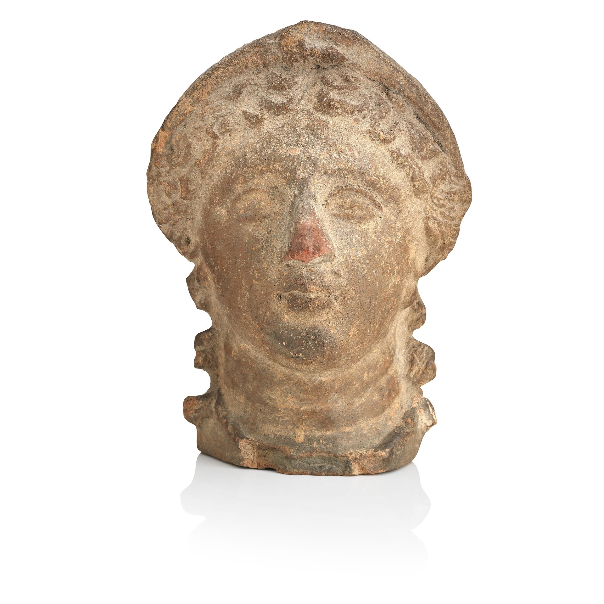 An Etruscan terracotta votive female head