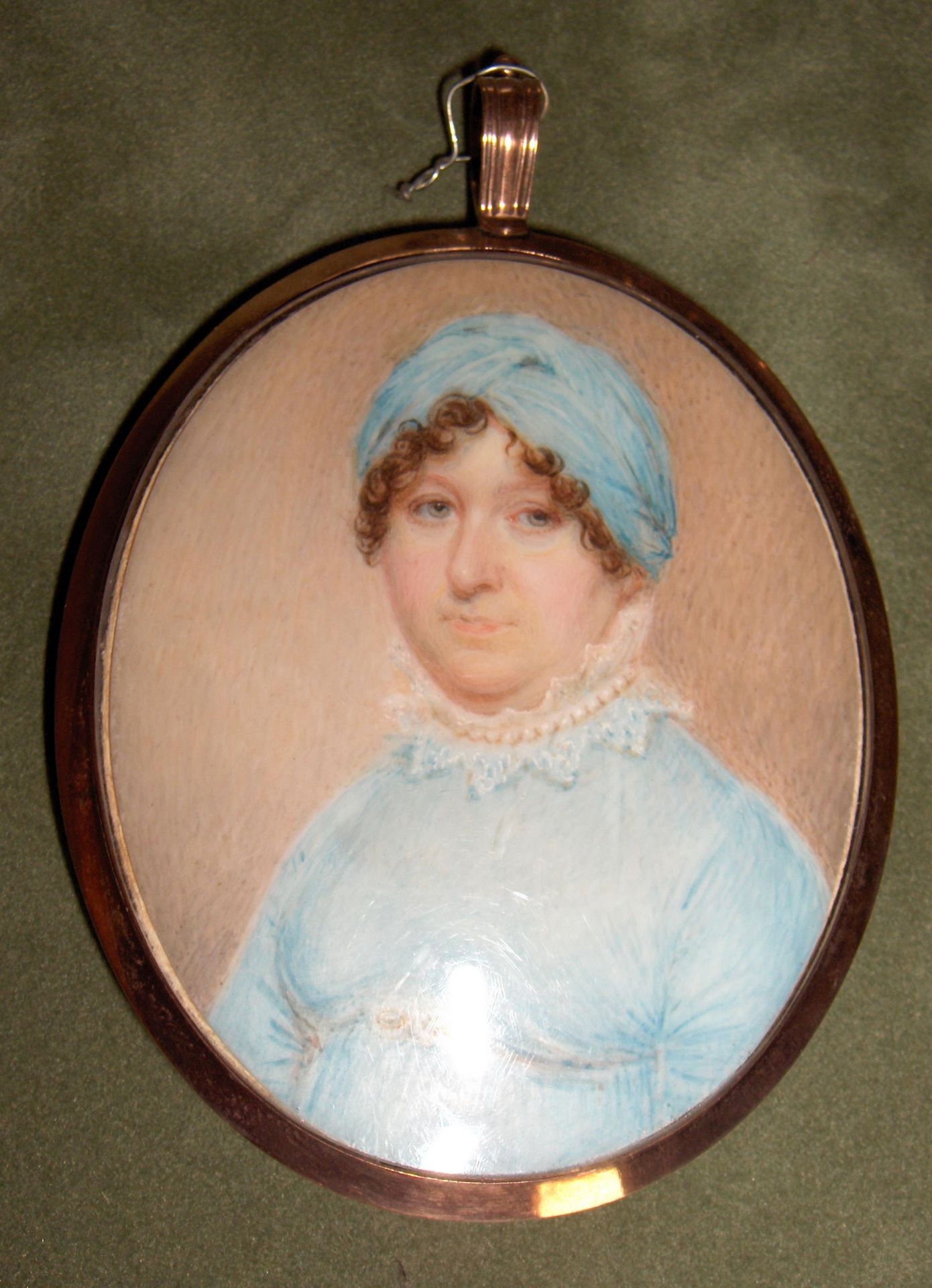 Manner of Manner of John Comerford, circa 1810 A Lady, wearing blue dress with frilled white coll...