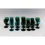 A collection of twenty seven green wine glasses Early 19th century