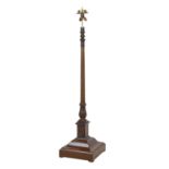 An early 20th century mahogany and brass standard lamp