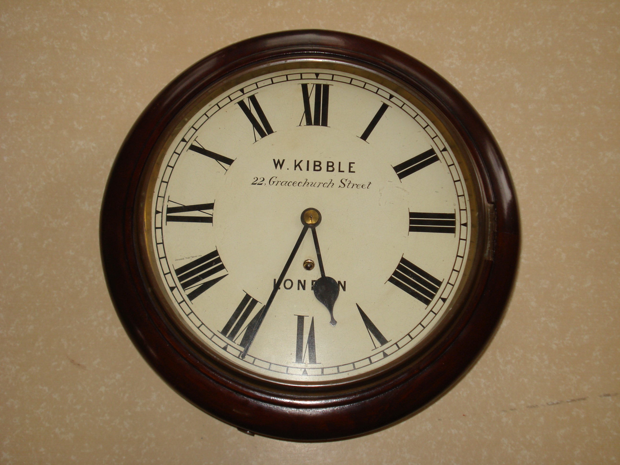 A 19th century Mahogany wall clock The dial insribed W. Kibble of 22 Gracechurch Street