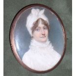 English School, circa 1810 A Lady, wearing white dress with high ruffled collar, her brown hair u...