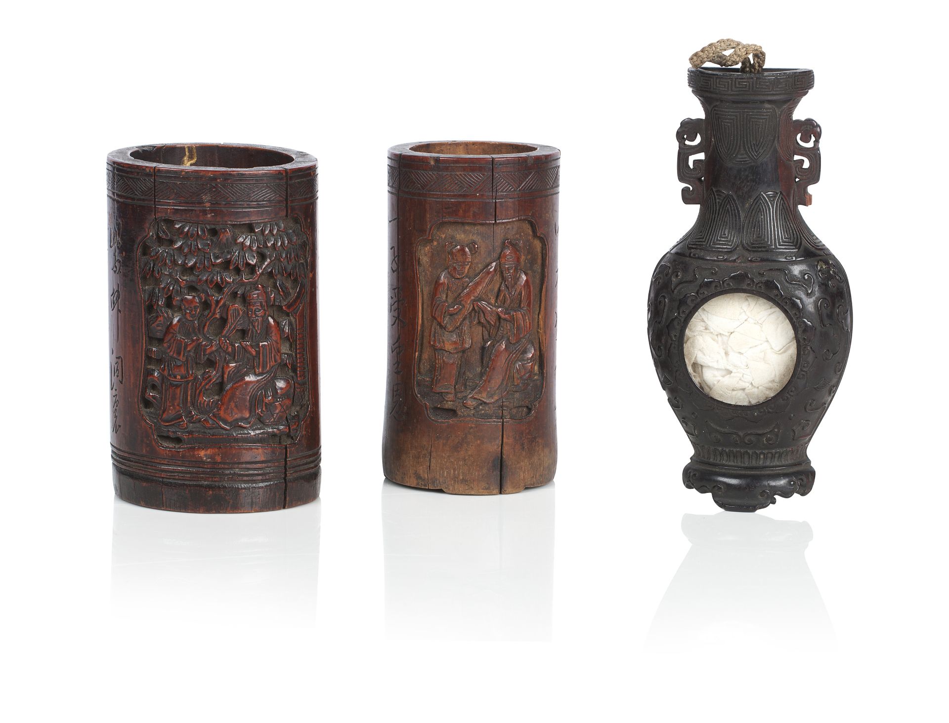 A wooden wall vase and two bamboo brush pots 19th century (3)