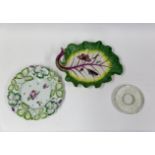 A Longton Hall 'Strawberry' plate, a Chelsea white trembleuse saucer and a Chelsea leaf dish circ...