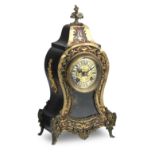 A French 19th century stained tortoiseshell boulle and gilt metal mounted mantel clock The moveme...