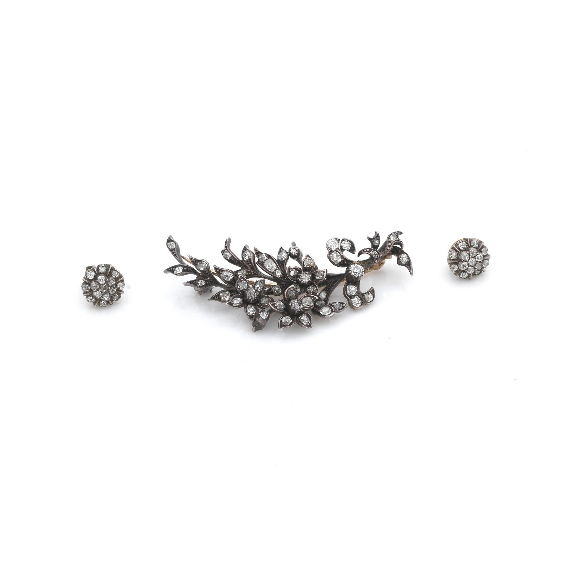 A diamond spray brooch, circa 1890, and a pair of diamond cluster earstuds