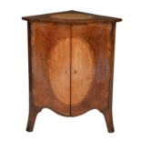 A George III harewood and rosewood inlaid serpintine corner cupboard