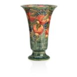 A large William Moorcroft 'Pomegranate' trumpet shaped vase Dated 1912