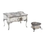 An Edwardian rococco silver jewellery casket, maker's mark WC, London, 1901, (2)