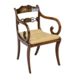 A Regency rosewood and brass inlaid elbow chair